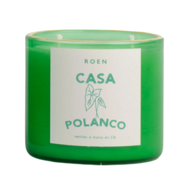candle in a green glass jar with a label that says "Roen Casa Polanco"