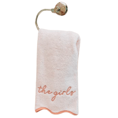 pink towel with scallops on a hook
