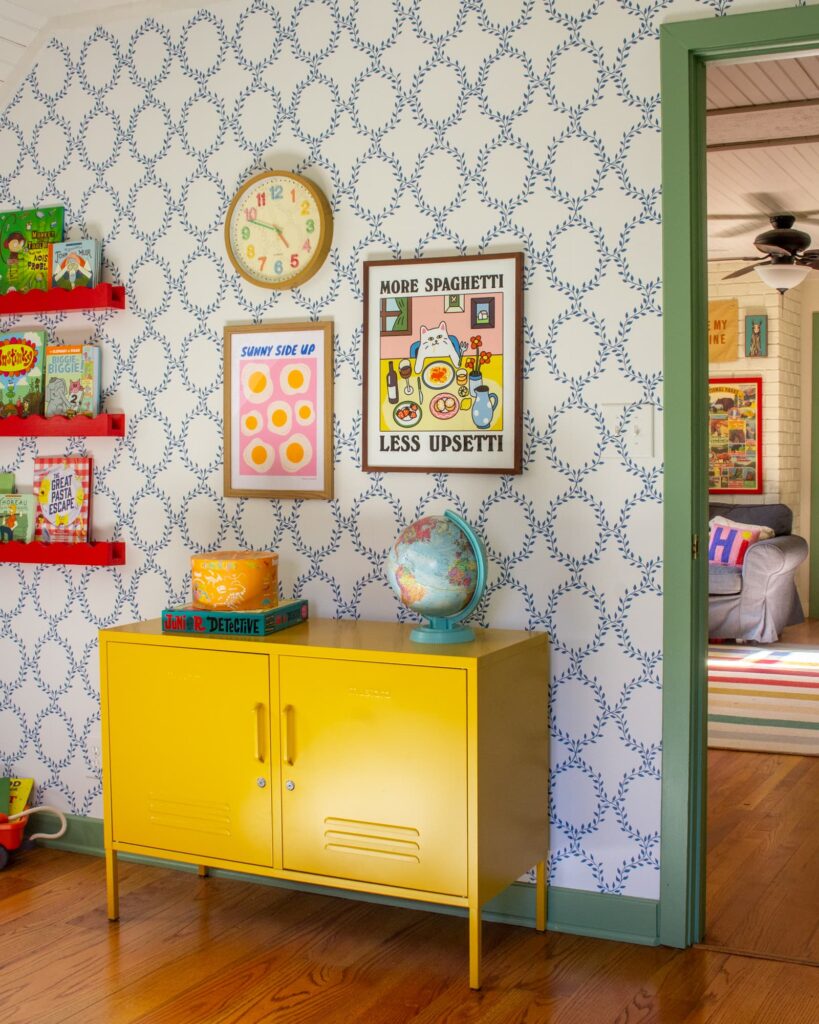 Mustard Made cabinet with wallpaper and art in a kid's bedroom